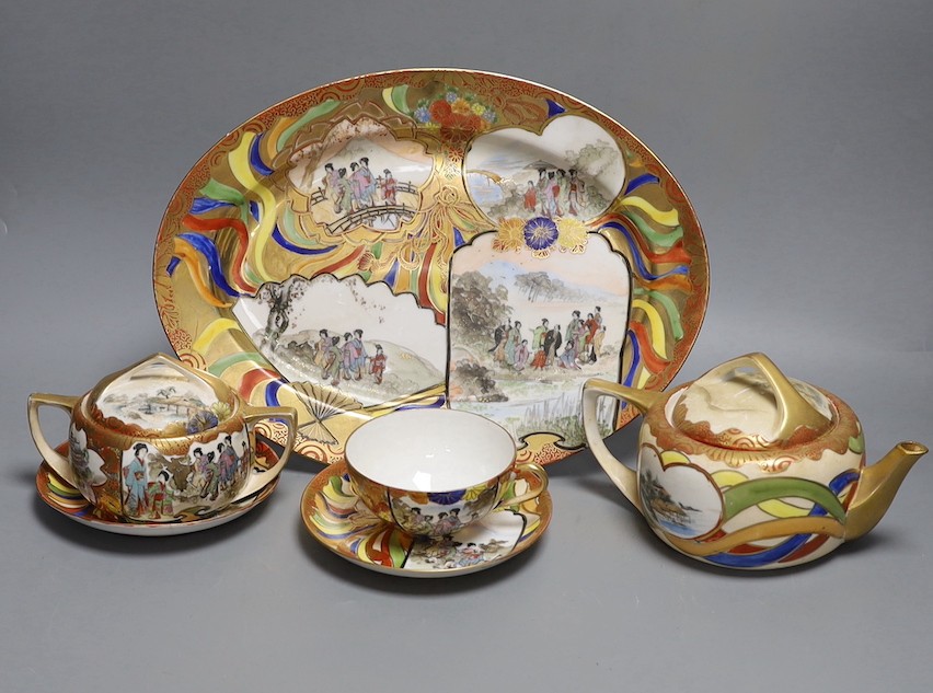 A Japanese Kutani porcelain teaset for 10 and a Japanese floral teapot